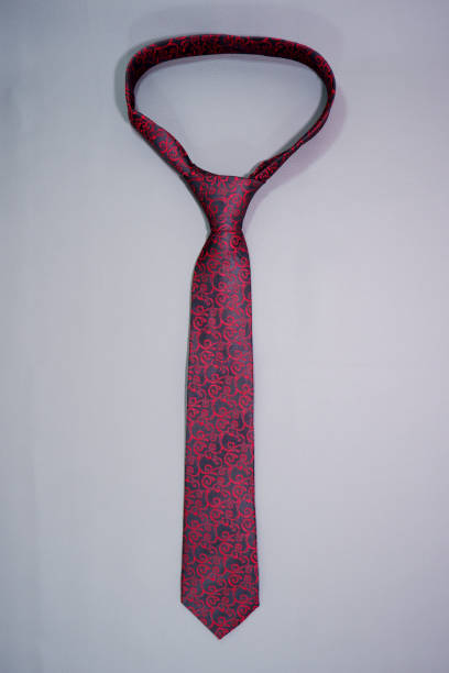 istock A floral pattern classic necktie isolated on dark grey background close-up view single object 2165802530