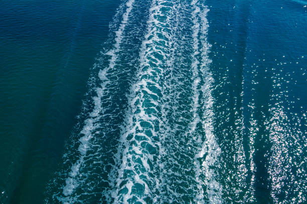 istock Cruise ship trails on water surface making white foam on blue sea. 2165807306