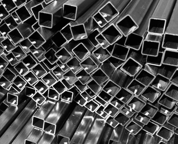 istock Steel profile manufacturing. Structural metal shapes. Metal profiles texture for constructions. Steel constructions factory background. 2165812916