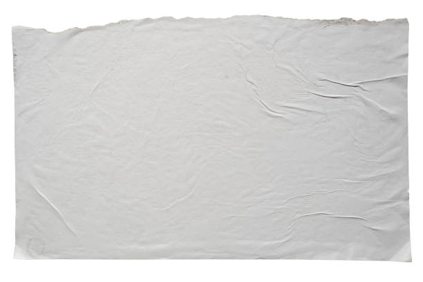 istock Torn A4 paper glued on a wall 2165813135
