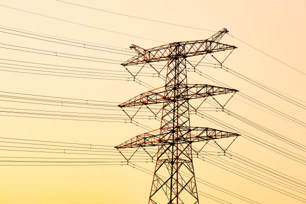 high voltage towers in sunrise