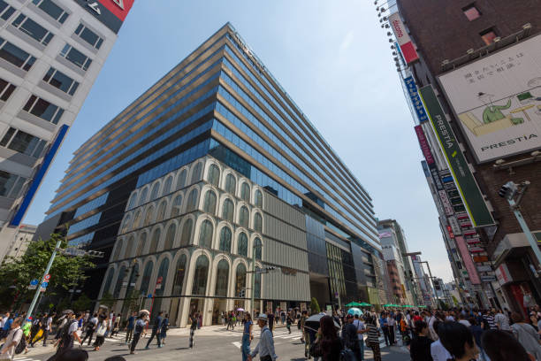 Tokyo, Japan - June 2, 2018 : Pedestrians walk past the commercial complex Ginza Six in Tokyo's Ginza shopping district, Japan.