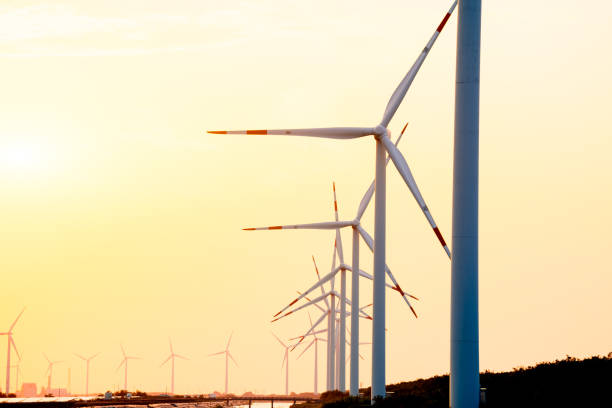 istock Wind turbine generators for clean electricity production at sunset 2165815749