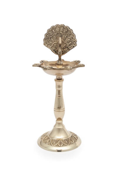 istock A designer brass diya, a traditional Hindu pooja accessory, isolated on a white background. 2165819316
