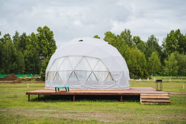 istock Experience a geodesic dome tent on a wooden platform in a tranquil natural setting, perfect for a serene and sustainable ecofriendly retreat amid verdant surroundings 2165820430