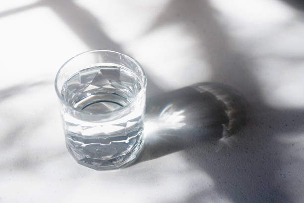 istock a glass of drinking water on white table. 2165820652
