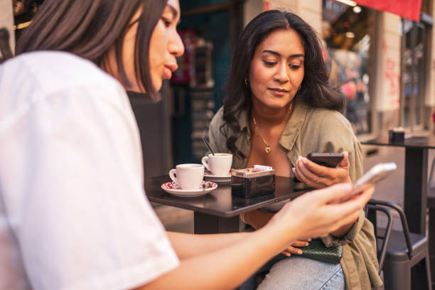 istock Two friends enjoying coffee while exploring Milano, Italy 2165821833