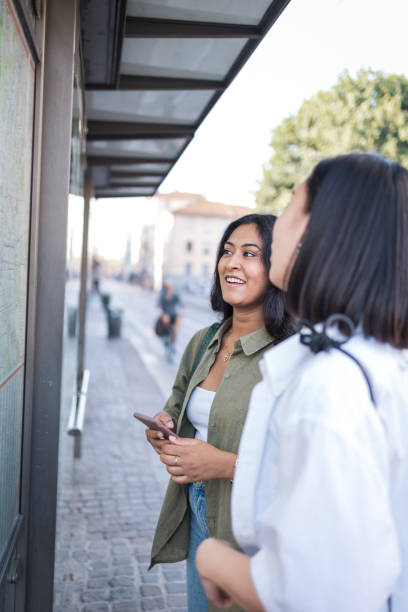 istock Two friends exploring Milano with a map in Italy 2165821844