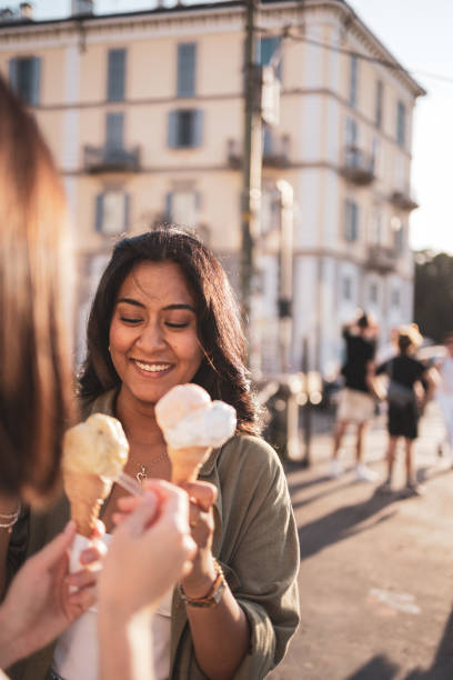 istock Friends enjoying ice cream together outdoors on a sunny day 2165821880