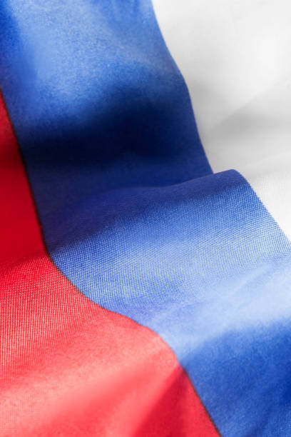 Draped russian tricolor national flag closeup as a background