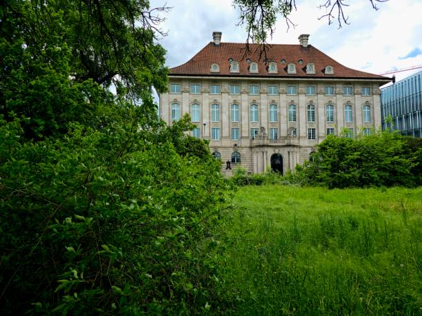 The Swiss Re - headquarters are located in Zurich (switzerland). The image shows the historic office building exterior during spring season.