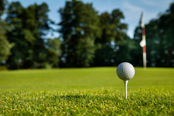 istock Closeup Golf ball on green grass on course 2165822682