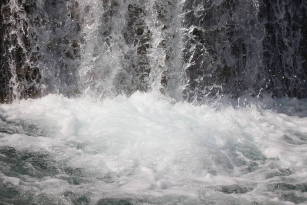 Pouring a waterfall in the moment with the visible suspended water particles