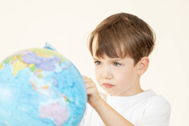 Little hand holding the globe. Earth day. Green concept