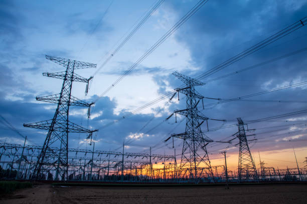 istock Pylons, high voltage pylons in the evening 2165825242