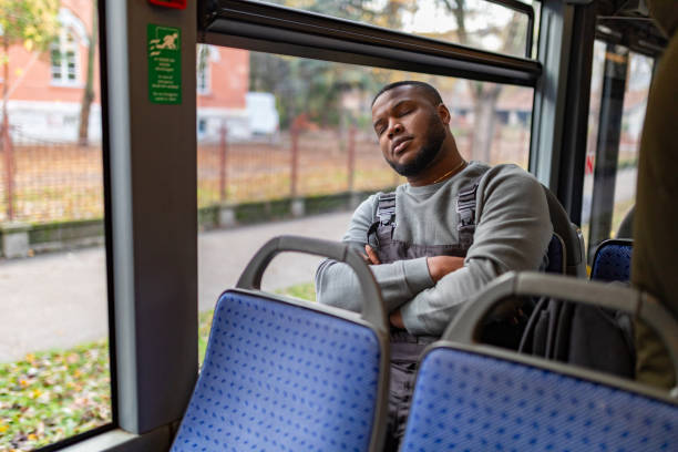 istock Young man riding in a bus 2165827617