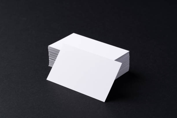 istock White blank business cards on dark black background 2165827701