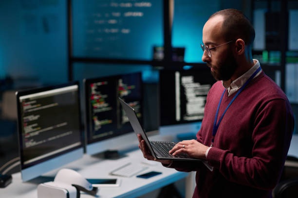 Bearded Man Holding Open Laptop