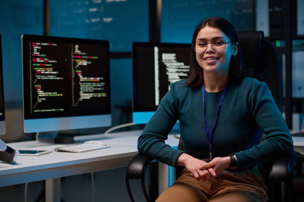 istock Smiling Girl as Female Computer Programmer at Workplace 2165829872