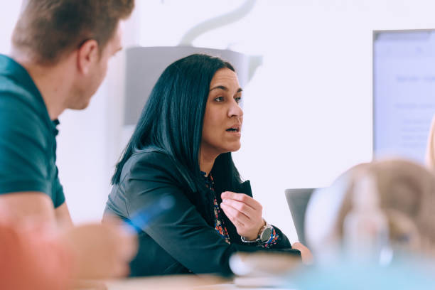 istock Diverse Business Team Discussing Projects in a Modern Glass Office. 2165830675
