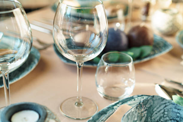 istock Beautiful elegant table setting with green stylish dishware and silver cutlery 2165832263