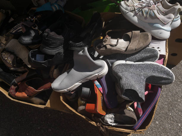 istock suitcase of used shoes 2165833160
