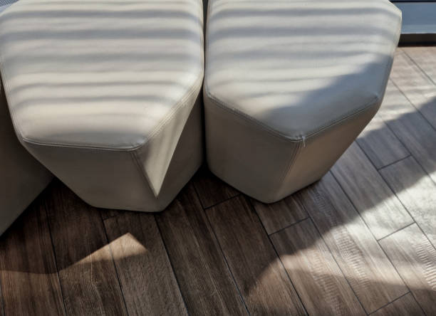 istock candy-shaped seat with padded multi-sided shape that fits together like a honeycomb, leather upholstery. lobby waiting room in the hotel at the entrance 2165835860