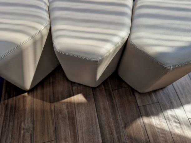 candy-shaped seat with padded multi-sided shape that fits together like a honeycomb, leather upholstery. lobby waiting room in the hotel at the entrance