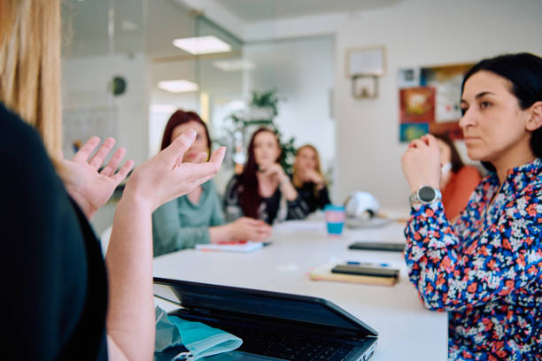 istock Diverse Business Team Discussing Projects in a Modern Glass Office. 2165835962