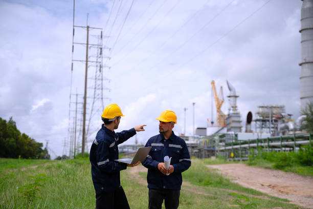 istock Blue collar workers are working at refinery factory. 2165836731
