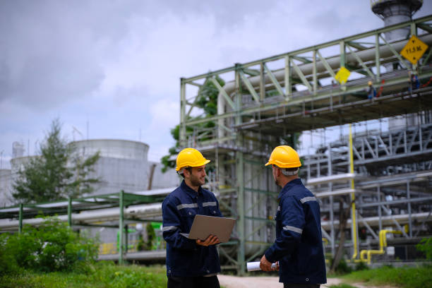 istock Blue collar workers are working at refinery factory. 2165836747