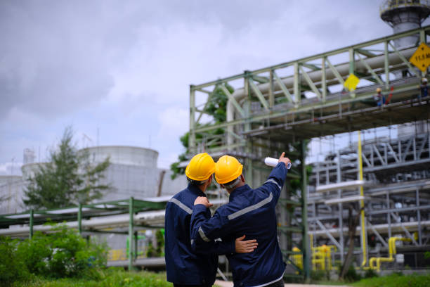 istock Blue collar workers are working at refinery factory. 2165836750