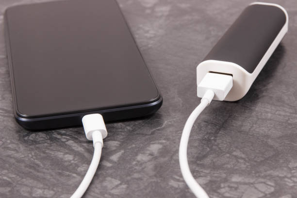 istock External powerbank charging empty battery of smartphone or mobile phone 2165836769