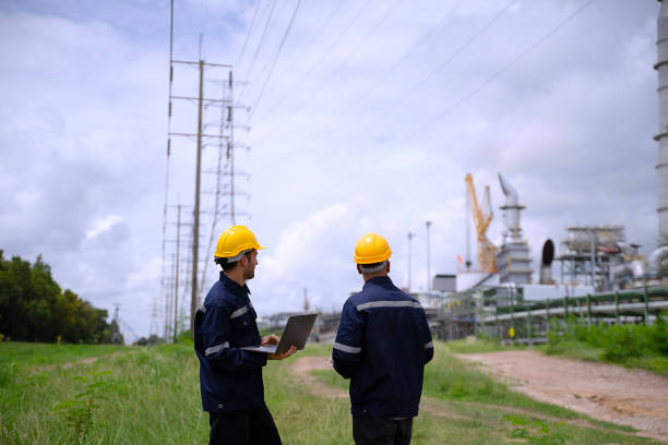 istock Blue collar workers are working at refinery factory. 2165838395