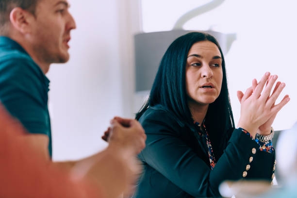 istock Diverse Business Team Discussing Projects in a Modern Glass Office. 2165838893