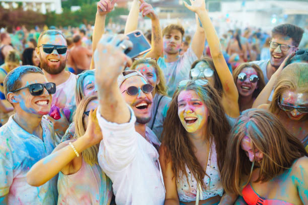 istock Group of friends having fun with powder paint. 2165839725