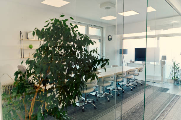 istock Modern Glass Office with Chairs, Projector, and Greenery 2165840186
