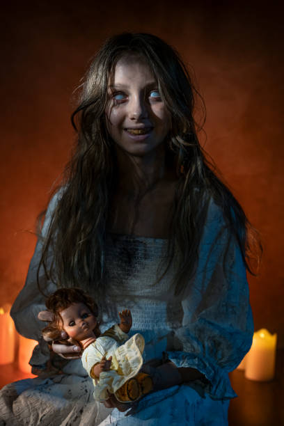 Horrifying image of a possessed girl with white eyes. Halloween theme.