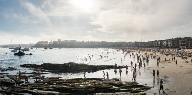 Bathers on the beach of Santa María del Mar in the city of Cádiz