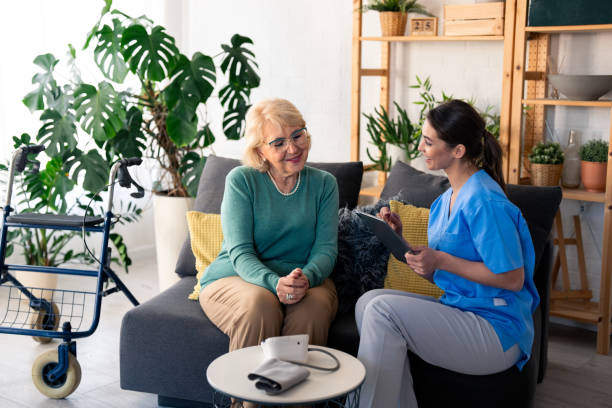 istock Compassionate Nurse Conducting Home Health Check 2165842916