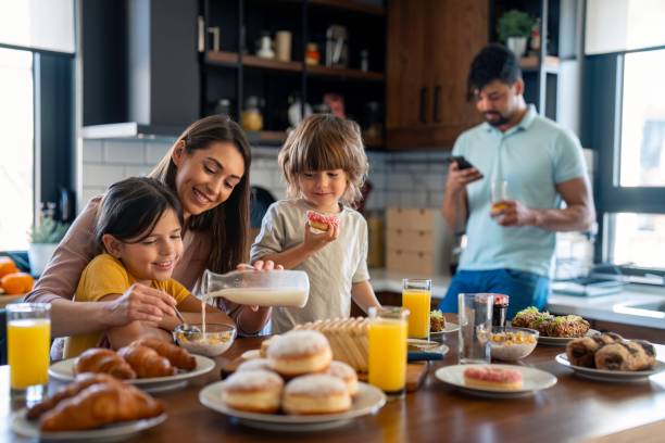 istock Diverse Family Enjoying Morning Routine in Kitchen 2165843092