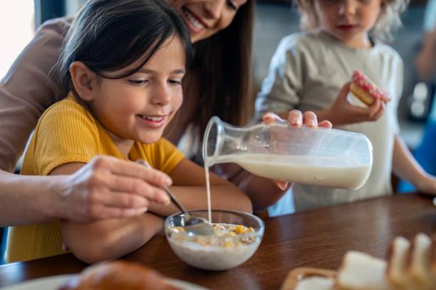 istock Family Breakfast Fun in Modern Kitchen 2165843096