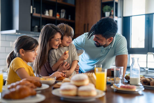 istock Diverse Family Enjoying Breakfast Preparation Together 2165843103