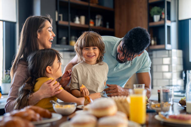 istock Diverse Family Engages in Breakfast Preparation in Modern Kitchen 2165843106
