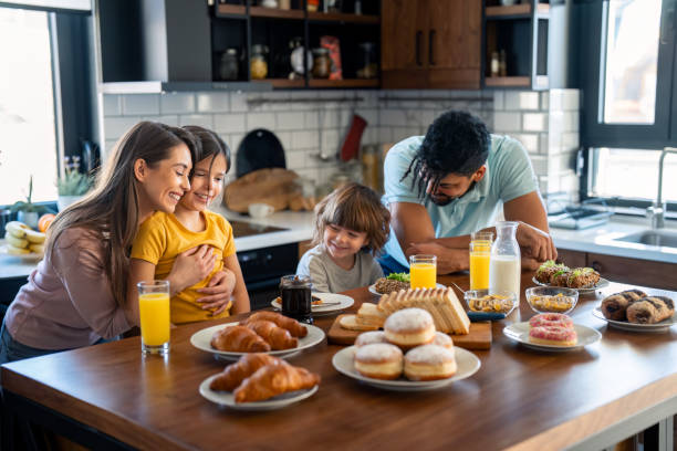 istock Joyful Family Breakfast Preparation in Modern Kitchen 2165843119