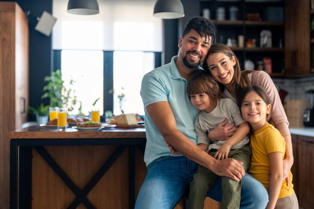 istock Joyful Diverse Family in Modern Kitchen 2165843151