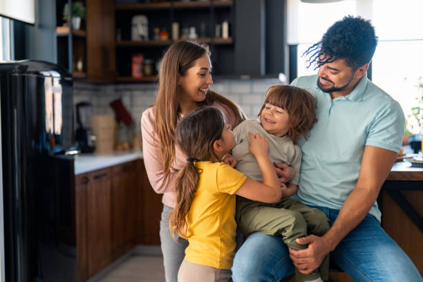 istock Joyful Diverse Family in Modern Kitchen 2165843162