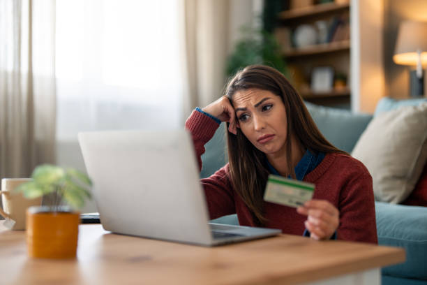 istock Caucasian Woman Concerned About Online Payment 2165843415