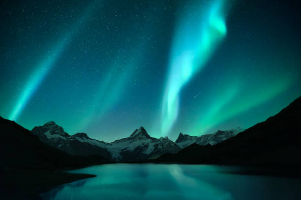 istock Northern lights in winter mountains 2165843538