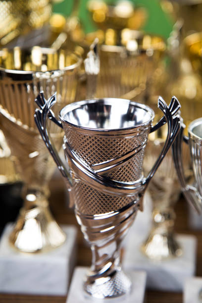 Award winning and championship concept, trophy cup on sport background